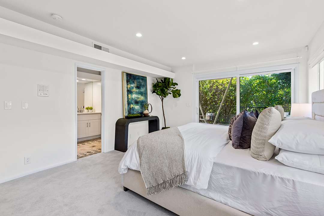 En suite bedroom with modern painting