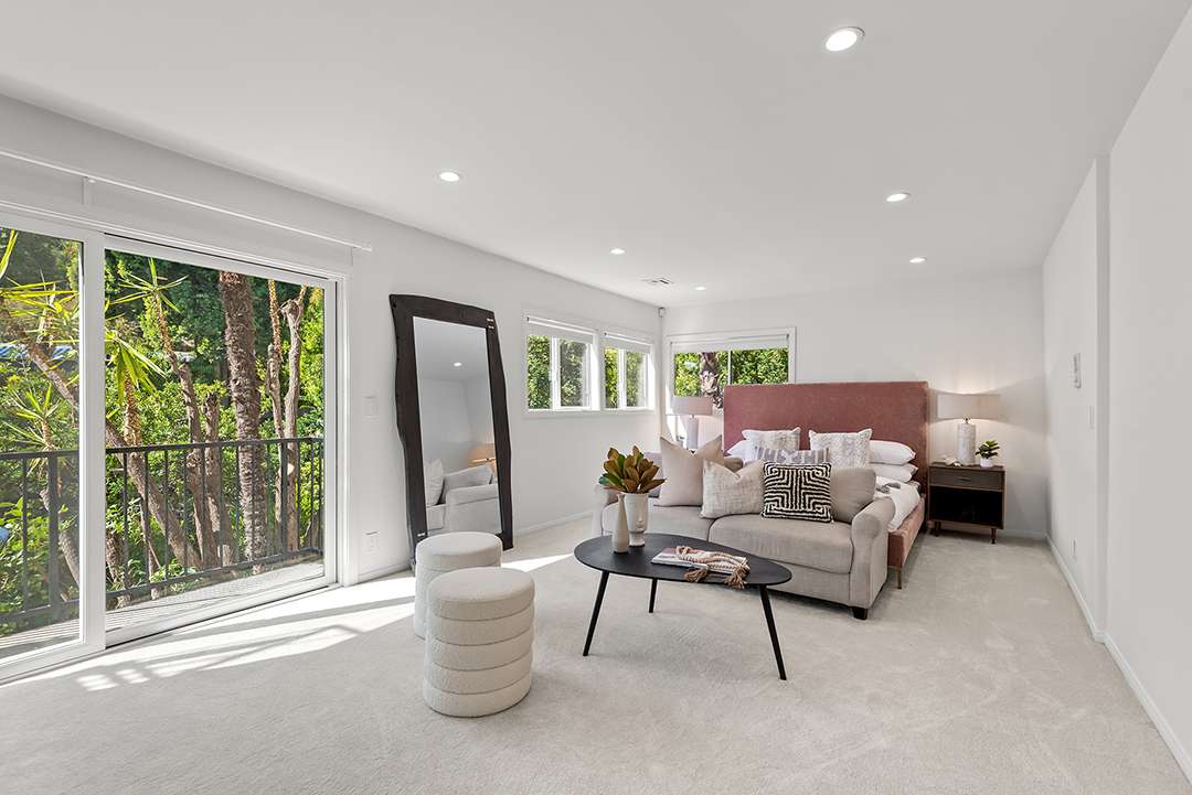 Spacious bedroom with a full length mirror