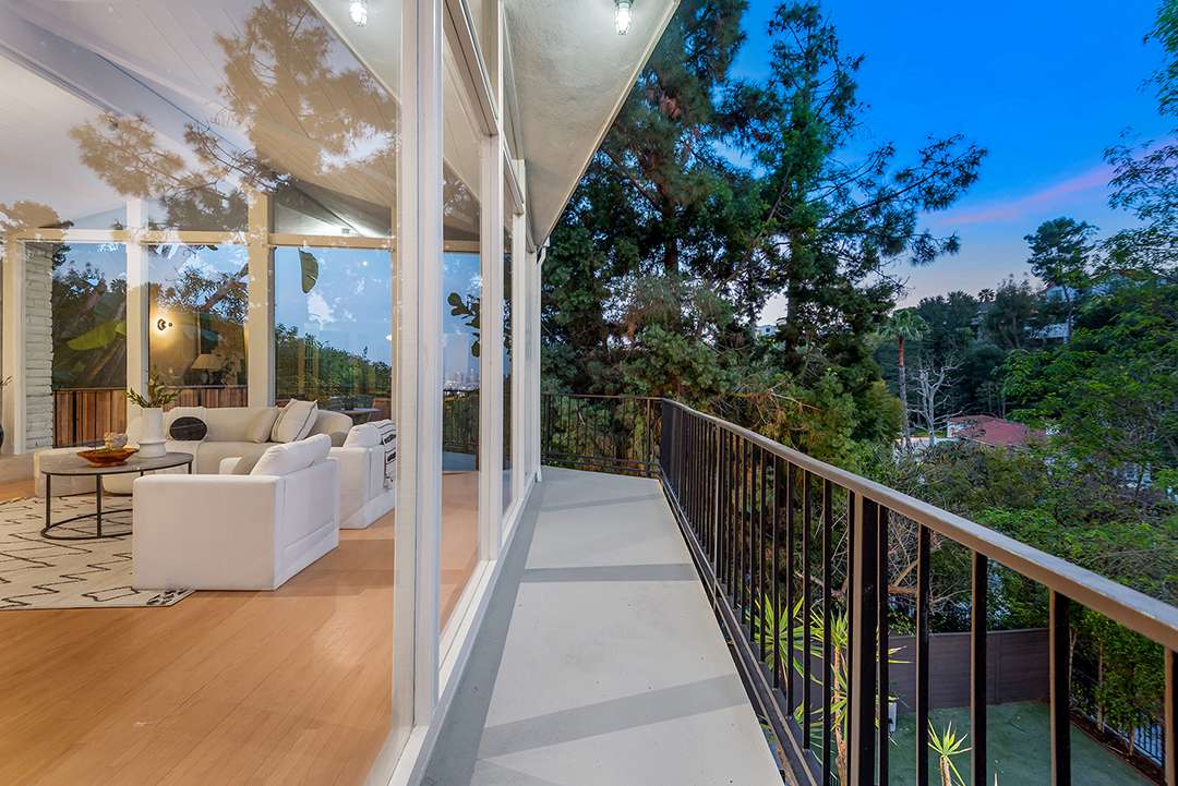 Enchanting glass windows surround balcony