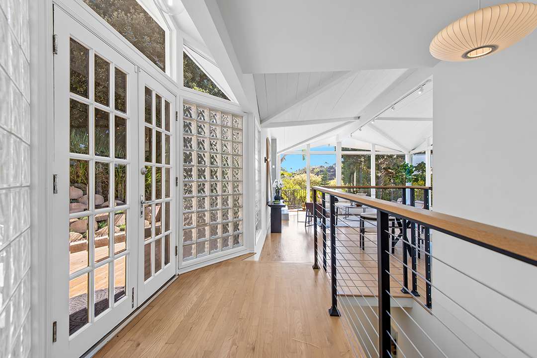Airy hallway that flows to living space