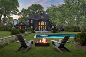Rectangular fire pit in farmhouse backyard