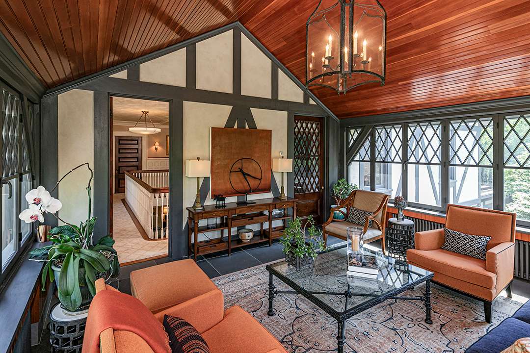 Barn-like seating area with orange accents
