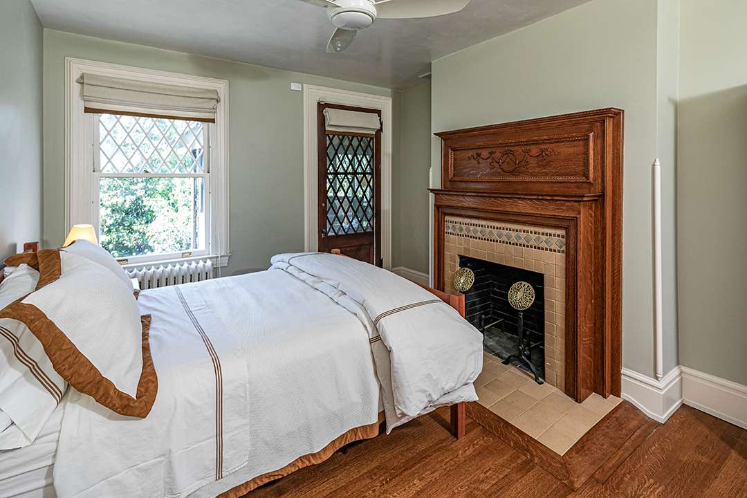 Traditional bedroom with fireplace