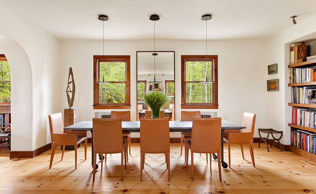 Sophisticated dining room with sculpture in corner