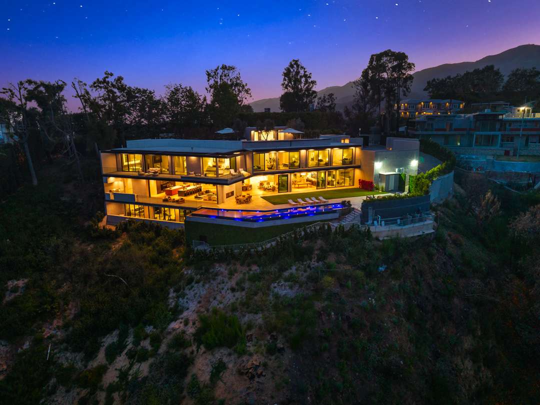 Drone shot of Pacific Palisades mansion at night