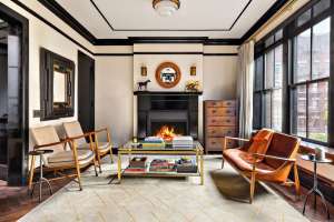 Neutral living room with black accents and fire place