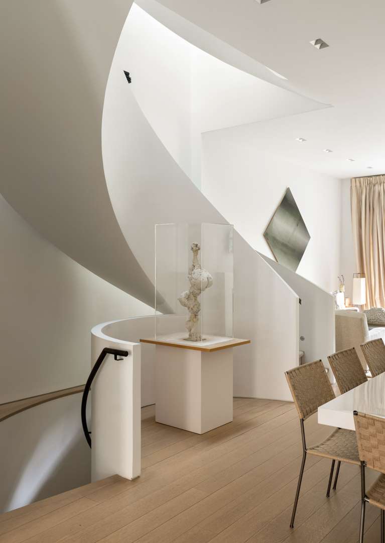 White spiral staircase in Chelsea townhouse