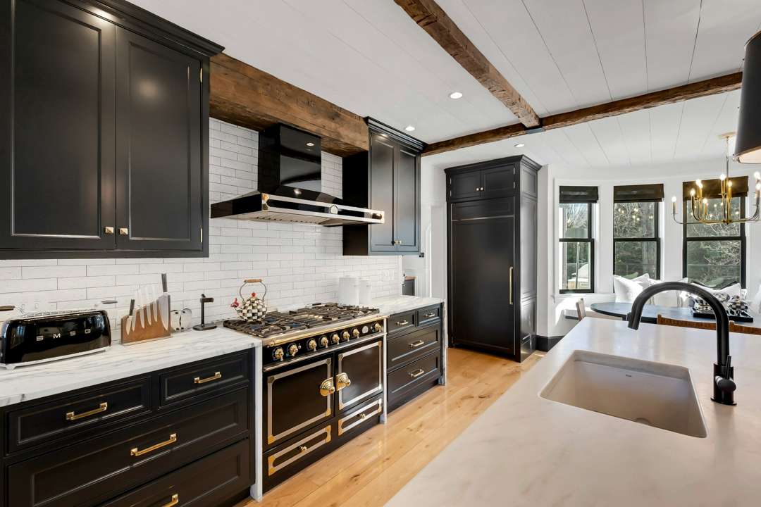 Bethenny Frankel's Greenwich house black, white, and gold kitchen