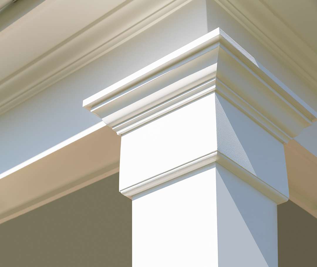 Coastal home white column trim