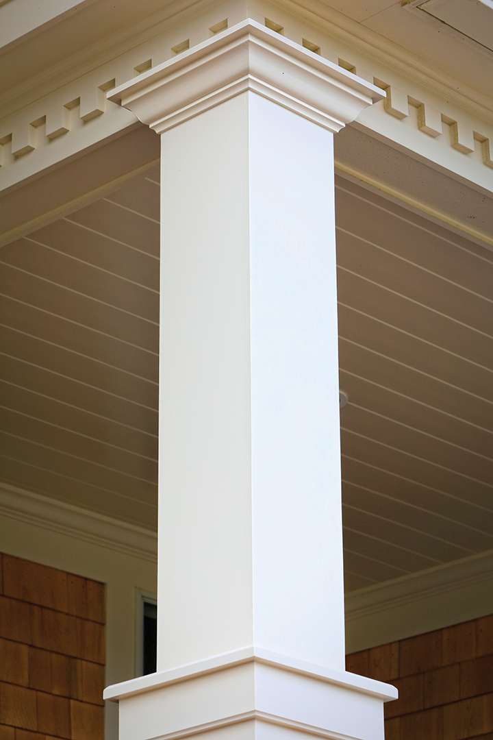 Coastal house with white column trim