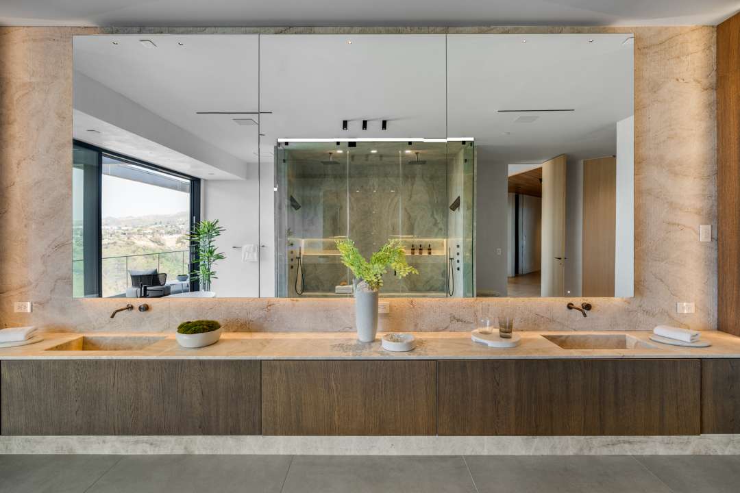 Bathroom with backlit mirror