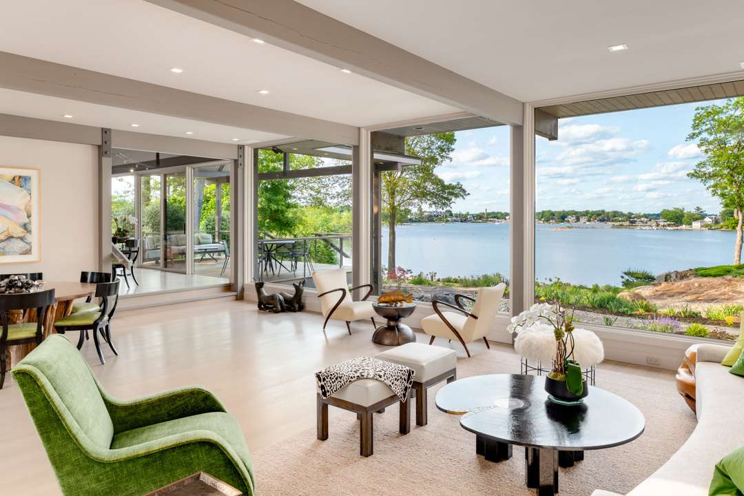 Neutral living room with green and floral accents