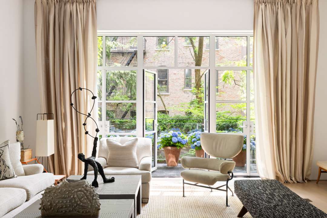 Neutral living room with balcony with hydrangeas