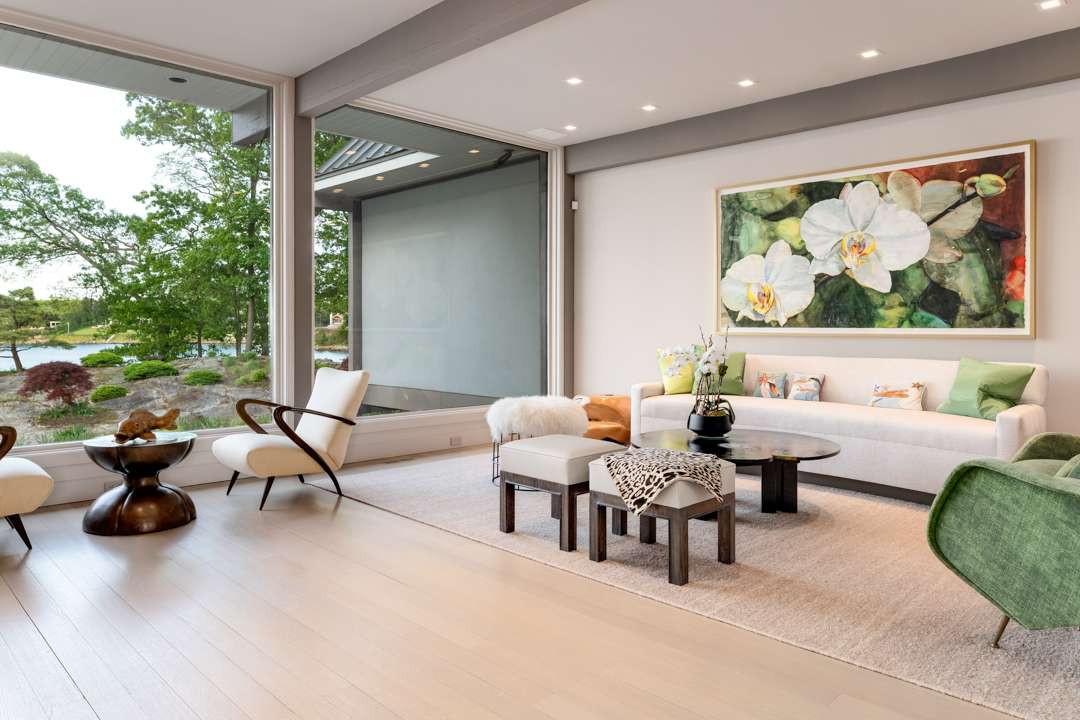 Neutral living room with green and floral accents