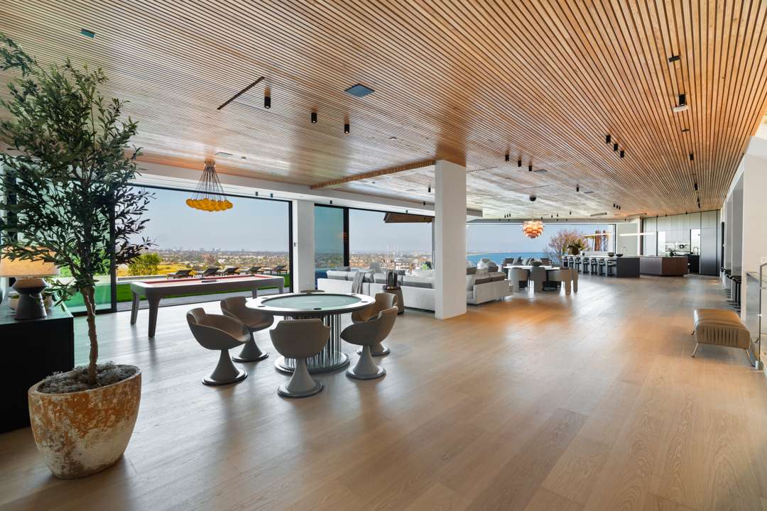 Game with and living room overlooking Pacific Palisades and ocean