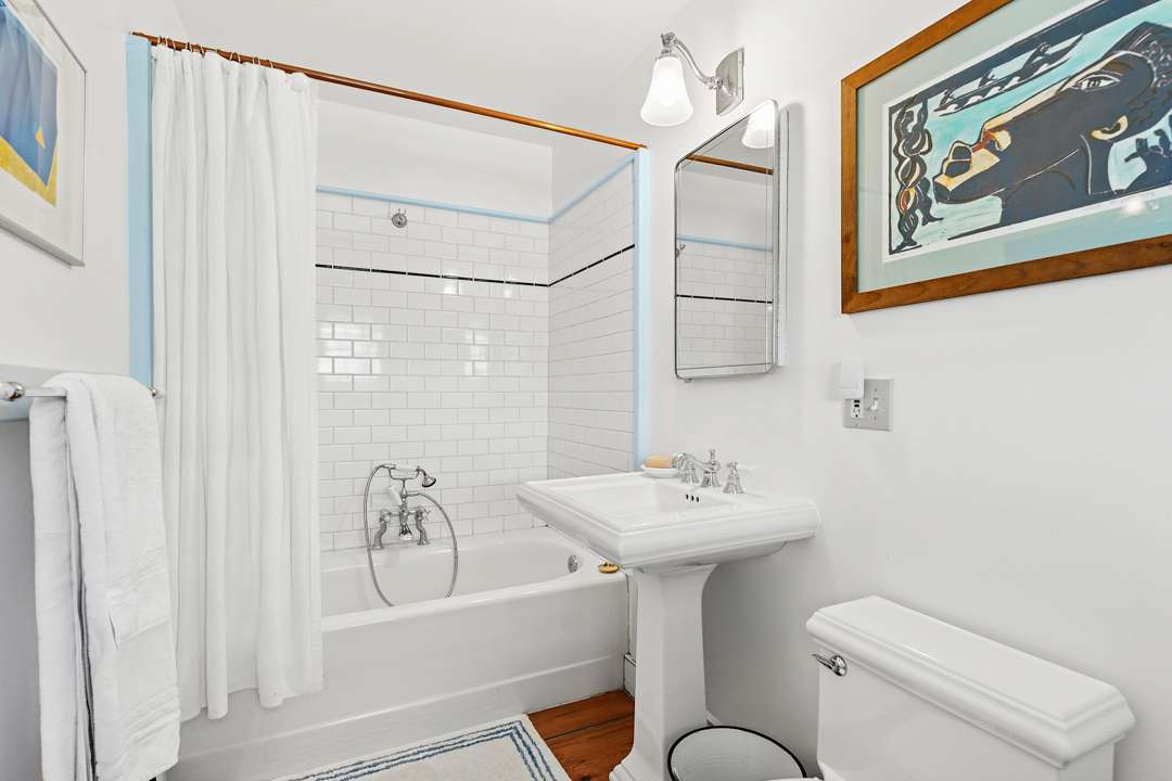 White bathroom with blue accents