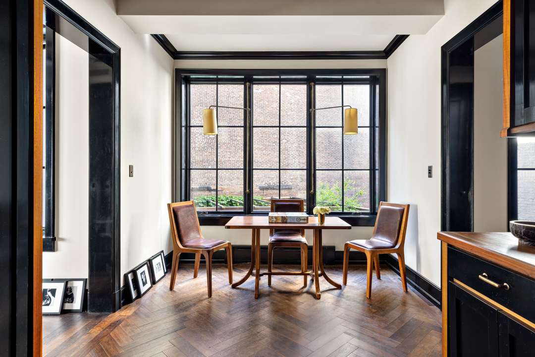 Breakfast nook with wood and brown leather table and chairs