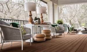 Furnished deck with arm chairs and lamps