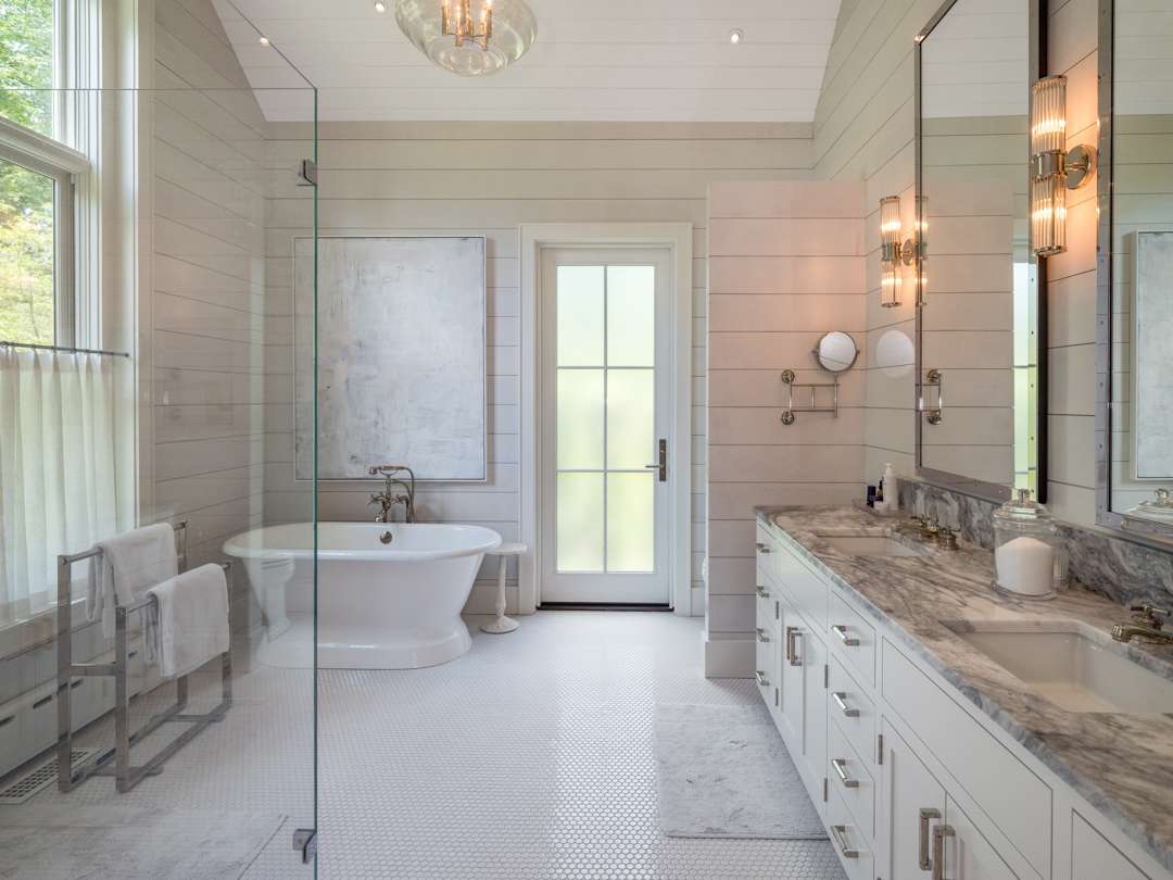 White bathroom with wood walls