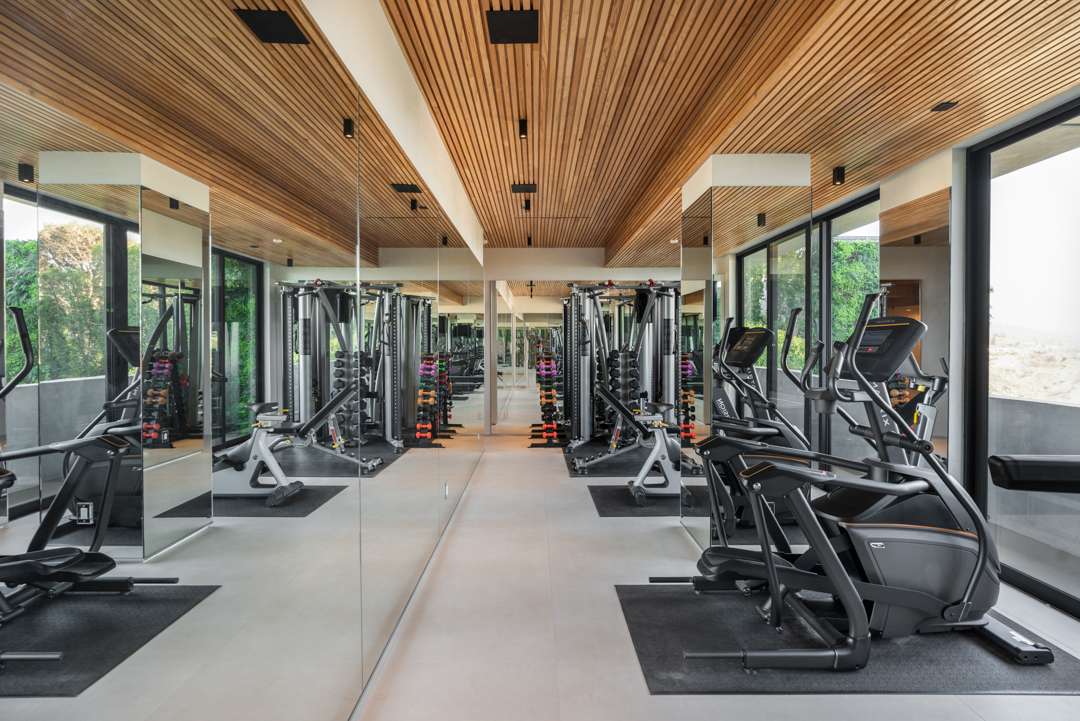 Home gym with wood ceiling