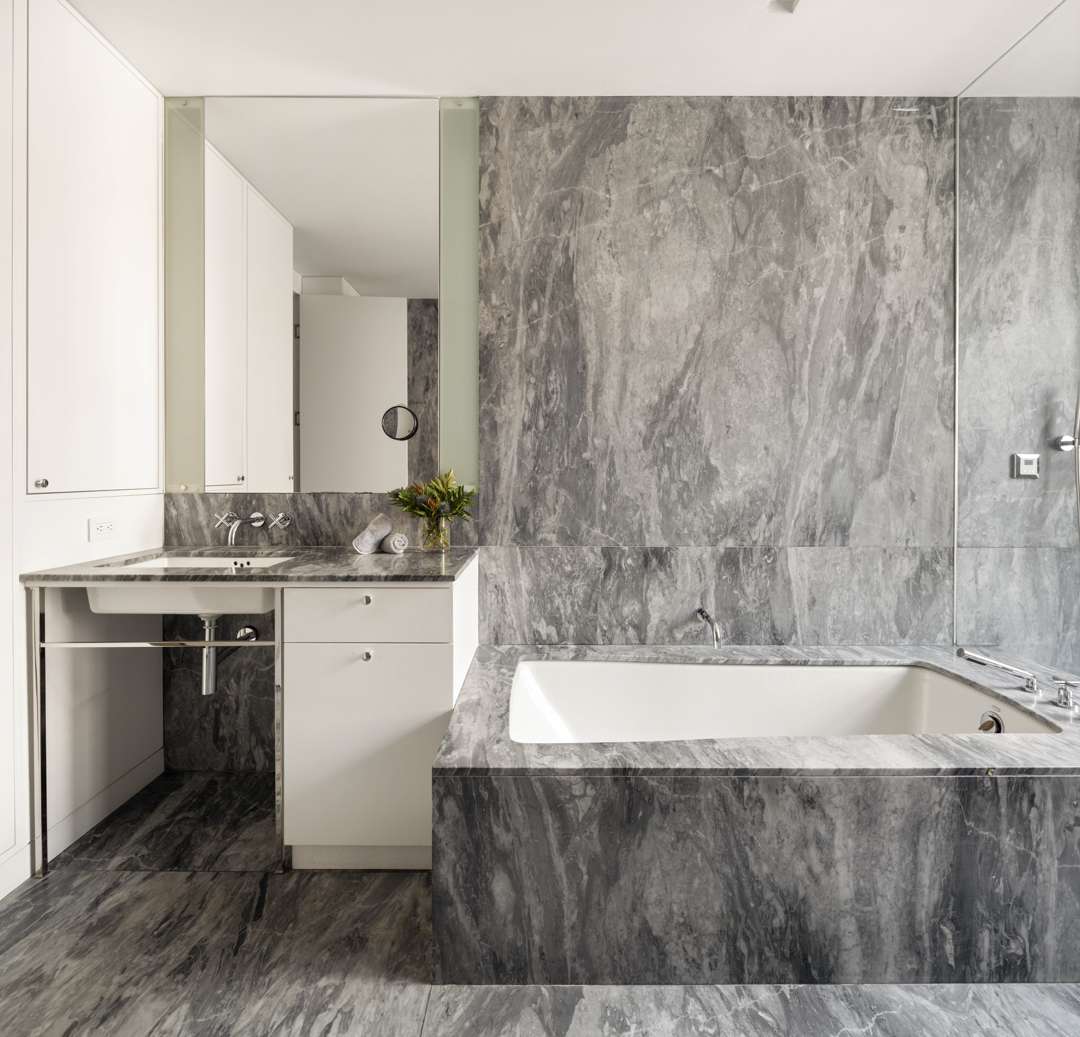 Grey marble bathroom with built in tub