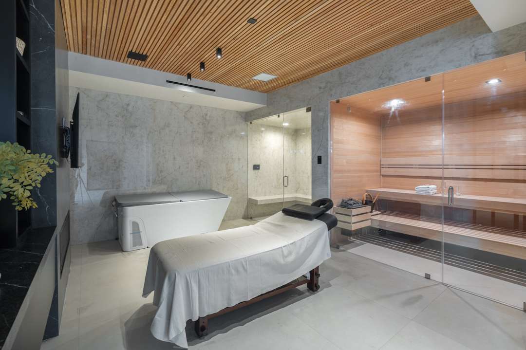 Home spa with massage bench, sauna, and cold plunge tub