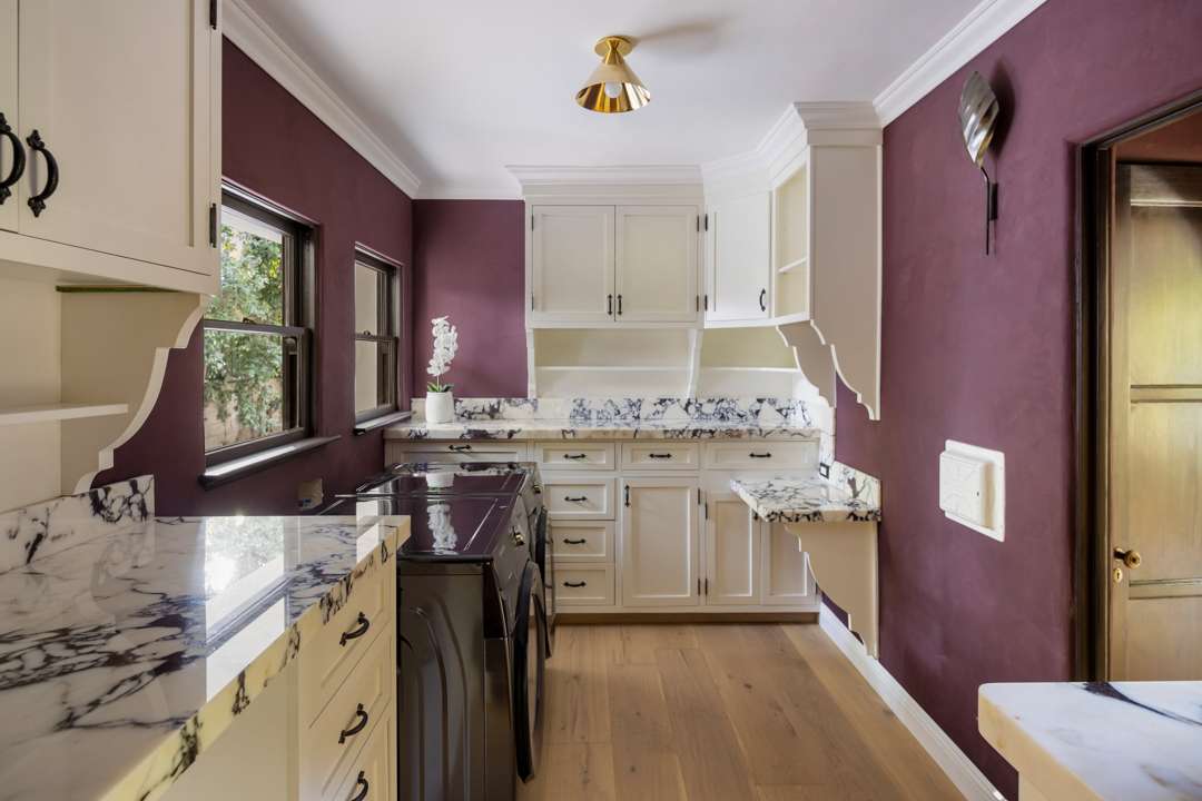 Bob Barker Former LA Home Laundry Room with Burgundy Walls