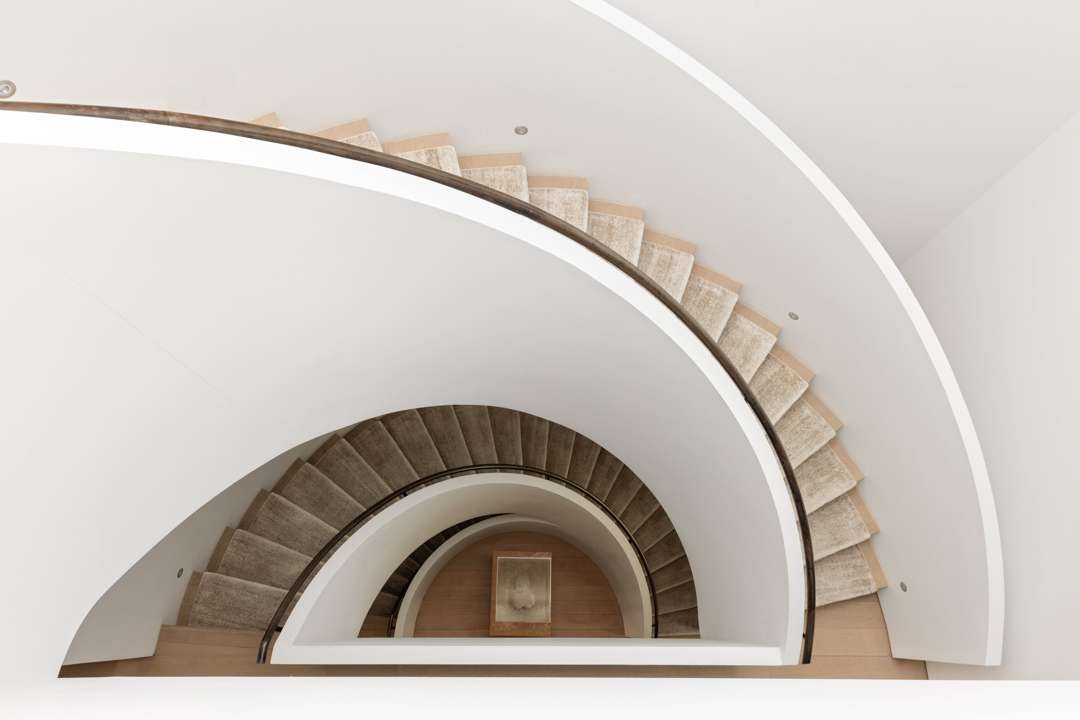 White and beige spiral staircase