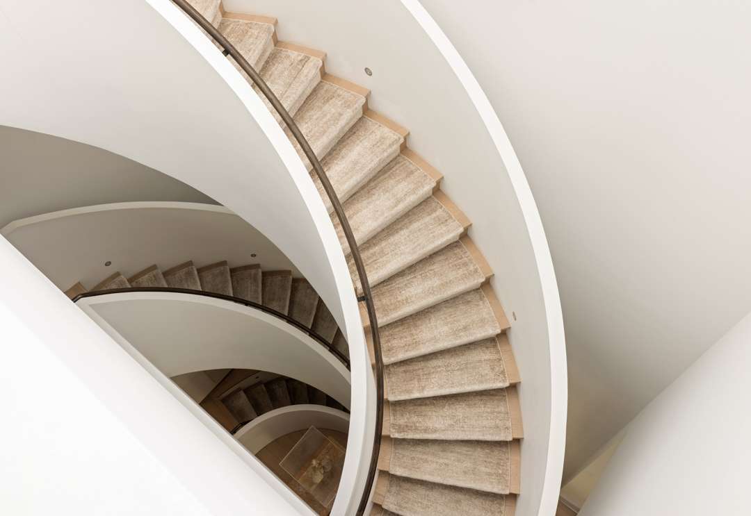 White and beige spiral staircase