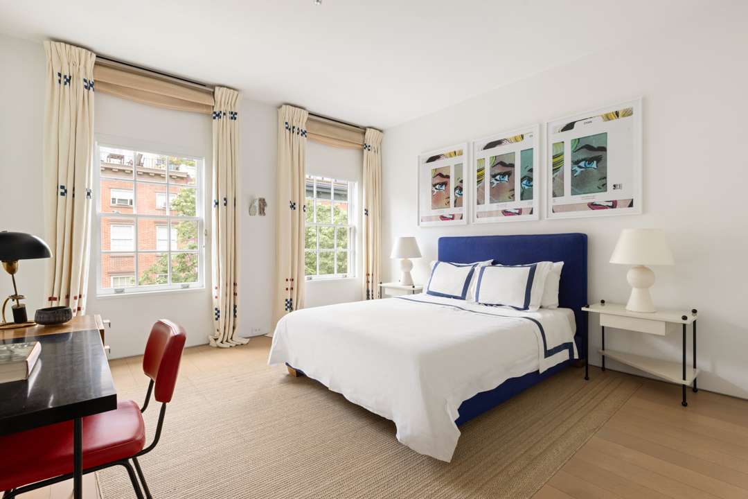 Blue and white bedroom with pop art