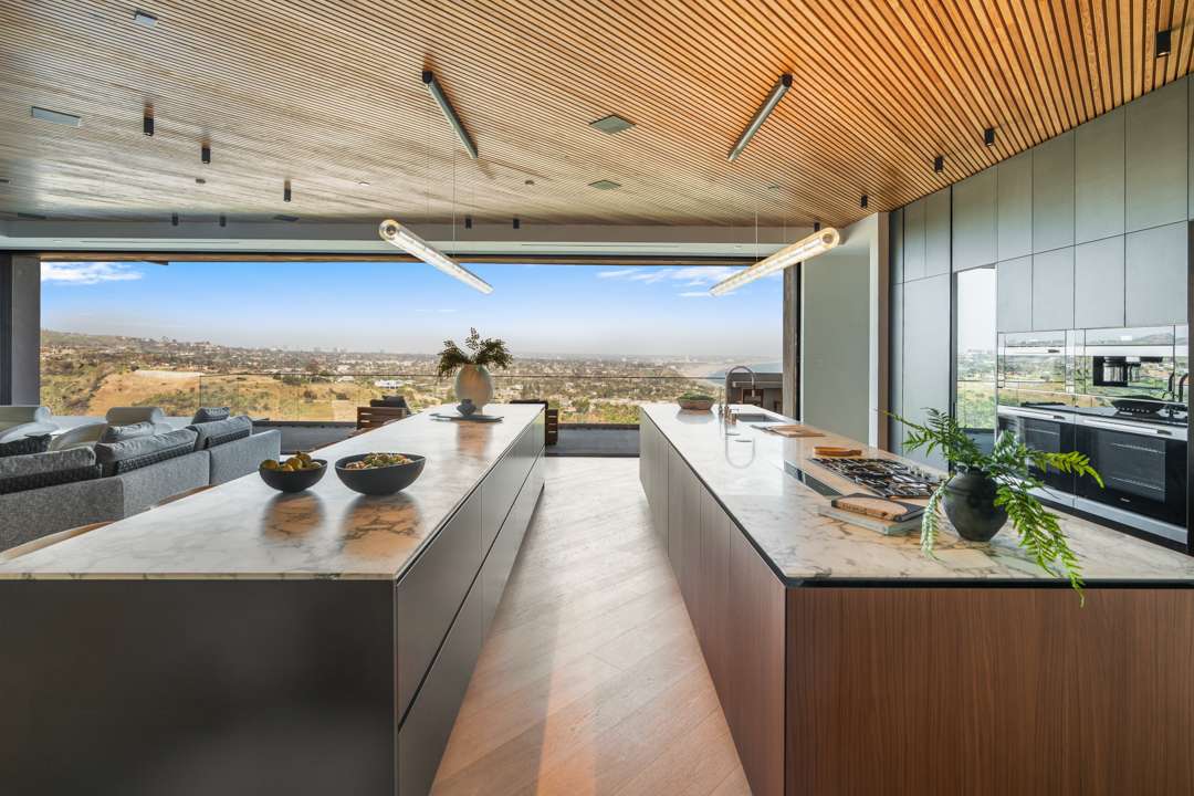 Marble island and counters in kitchen overlooking Pacific Palisades