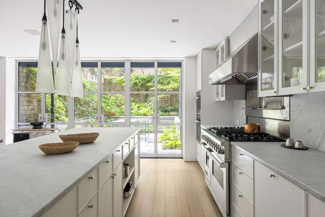 White kitchen with grey marble