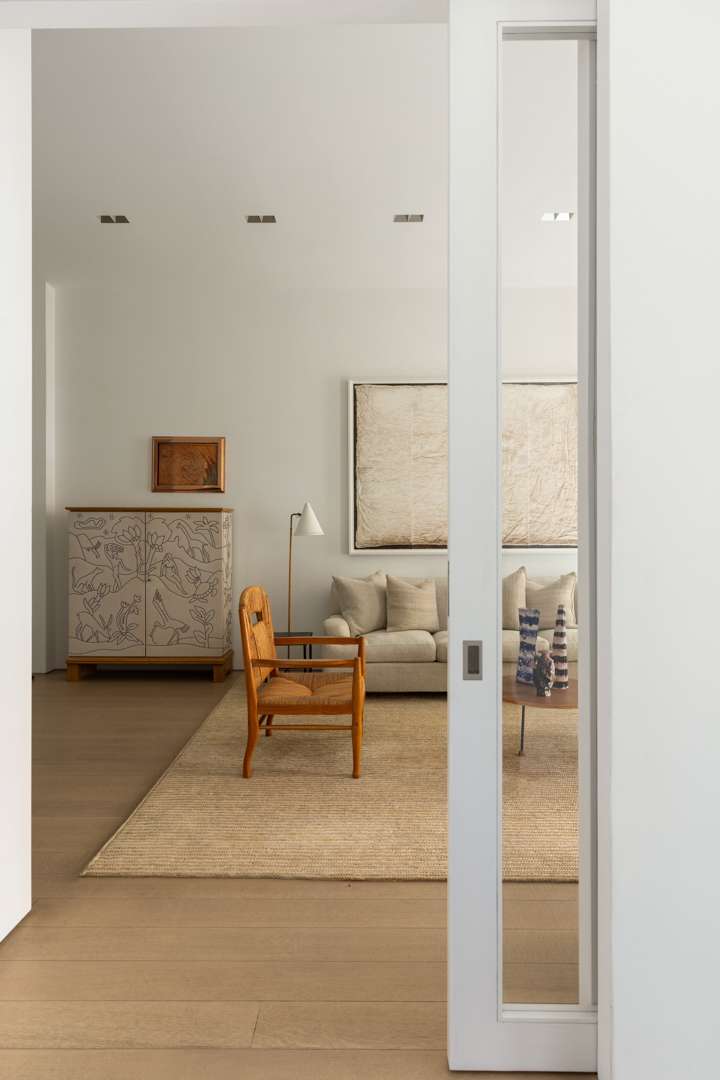 Neutral living room with white sliding door