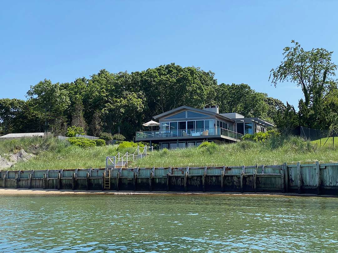 East Hampton backyard on the bay with a dock