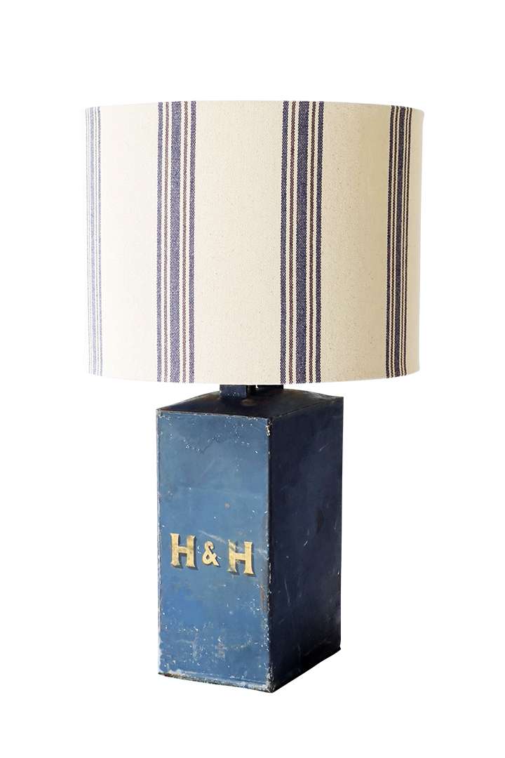 Blue lamp with white, blue, and red lampshade