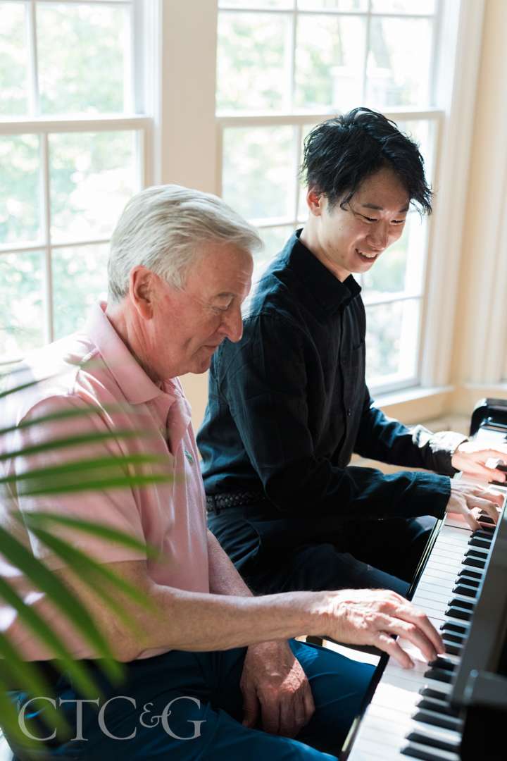 Grant Slinger and TK duet on piano at Champagne on the Deck