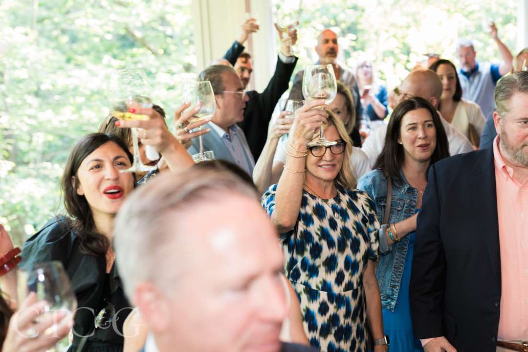 Guests toasting at Champagne on the Deck