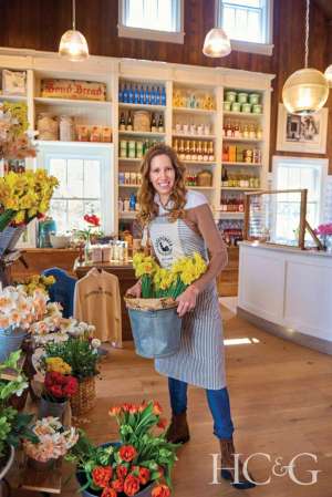 Sagaponack General Store owner Mindy Gray holding flowers
