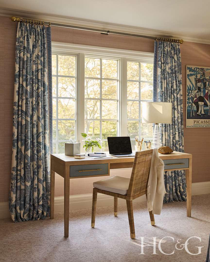 Hamptons home blue, white, and pink bedroom with desk
