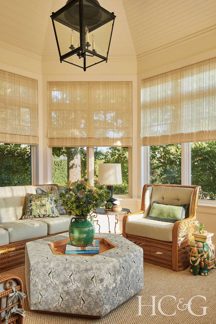 Neutral sunroom with blue and green accents
