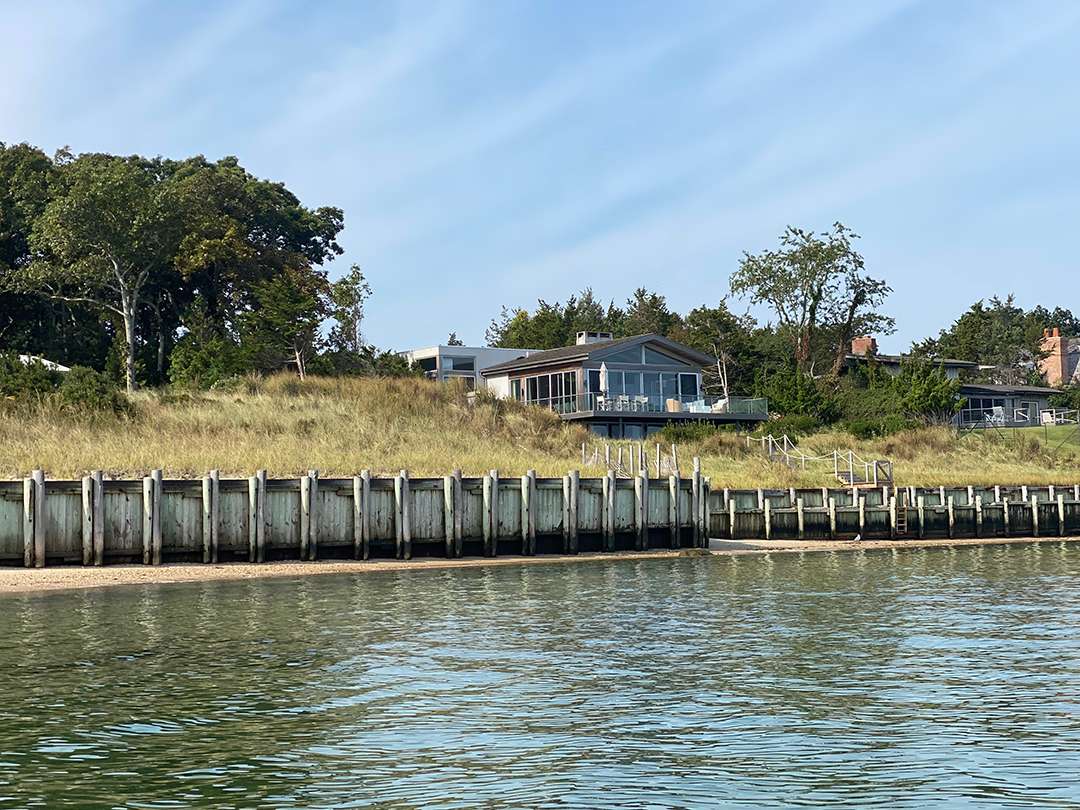 East Hampton backyard on the bay with a dock