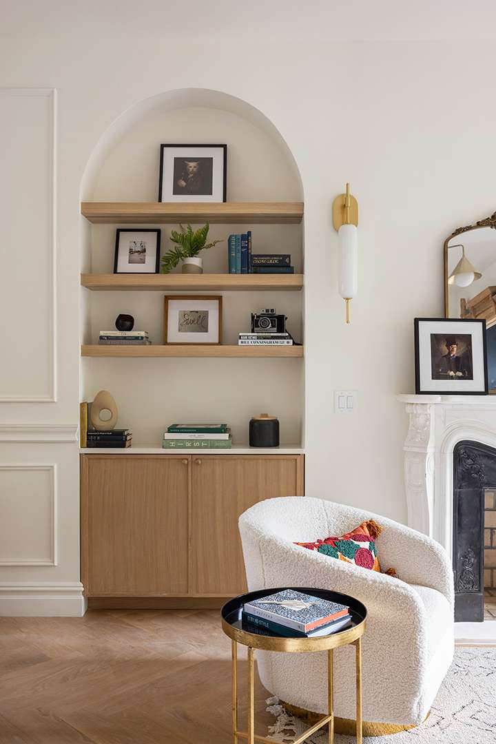 Brownstone Modern Living Room With Wood Shelves and Storage