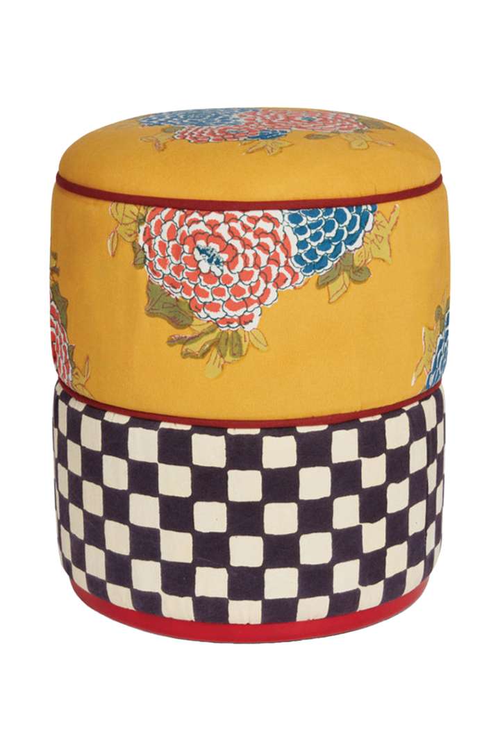 Yellow, red, black, blue, and white floral and checkered pouf