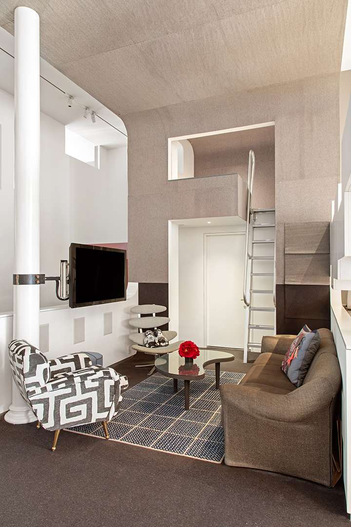 Small living room with ladder decoration and funky furniture