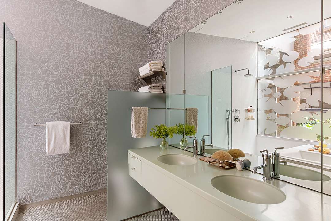 Bathroom with grey and white abstract wallpaper