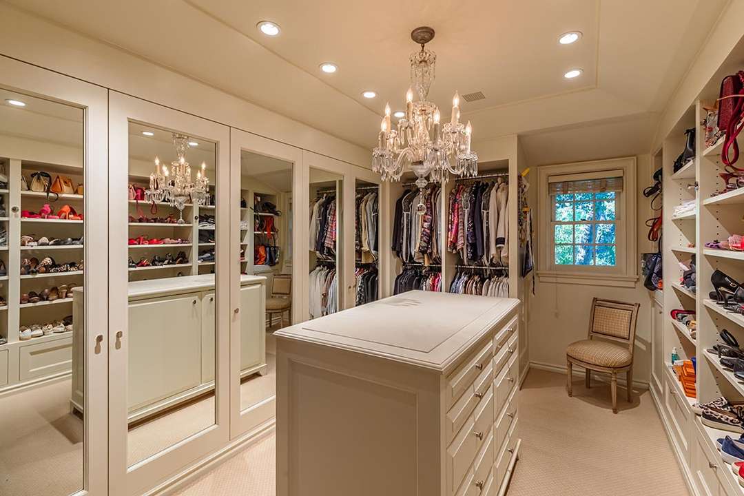 White closet with crystal chandelier at Audrey Hepburn's former LA mansion