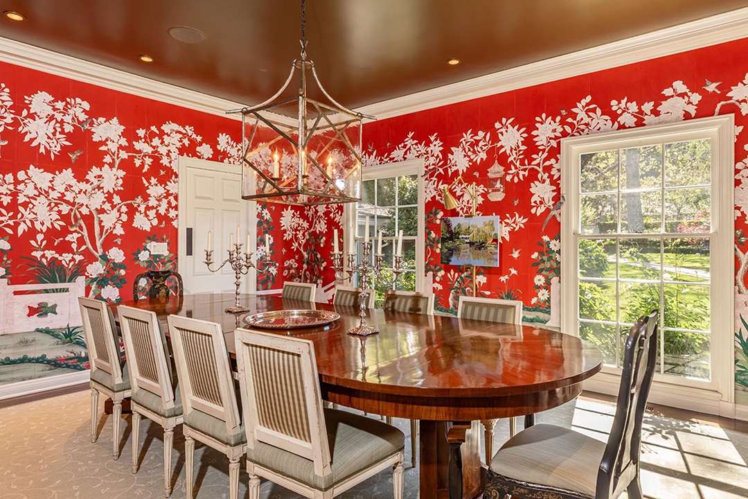 Dining room with red and white floral wallpaper at Audrey Hepburn's former LA mansion