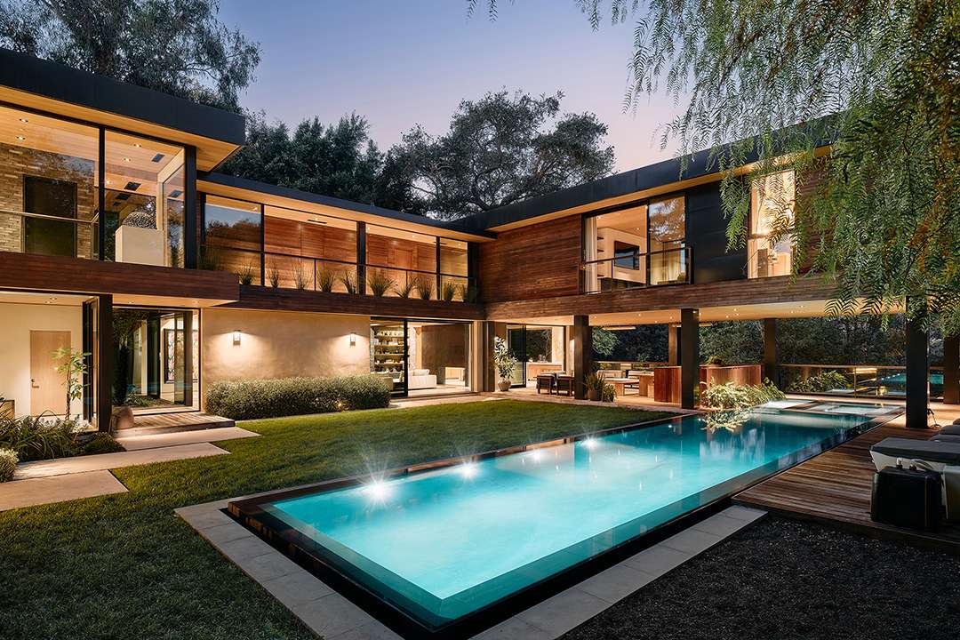 Lizzo's backyard pool with wood deck