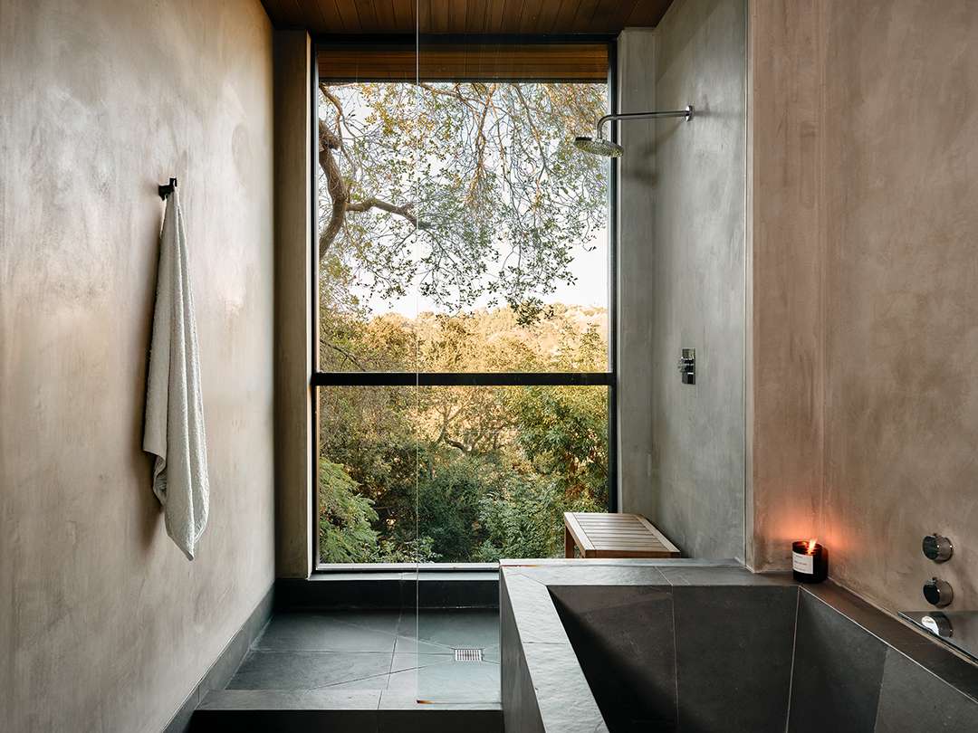 Lizzo's bathroom with black tile and beige walls