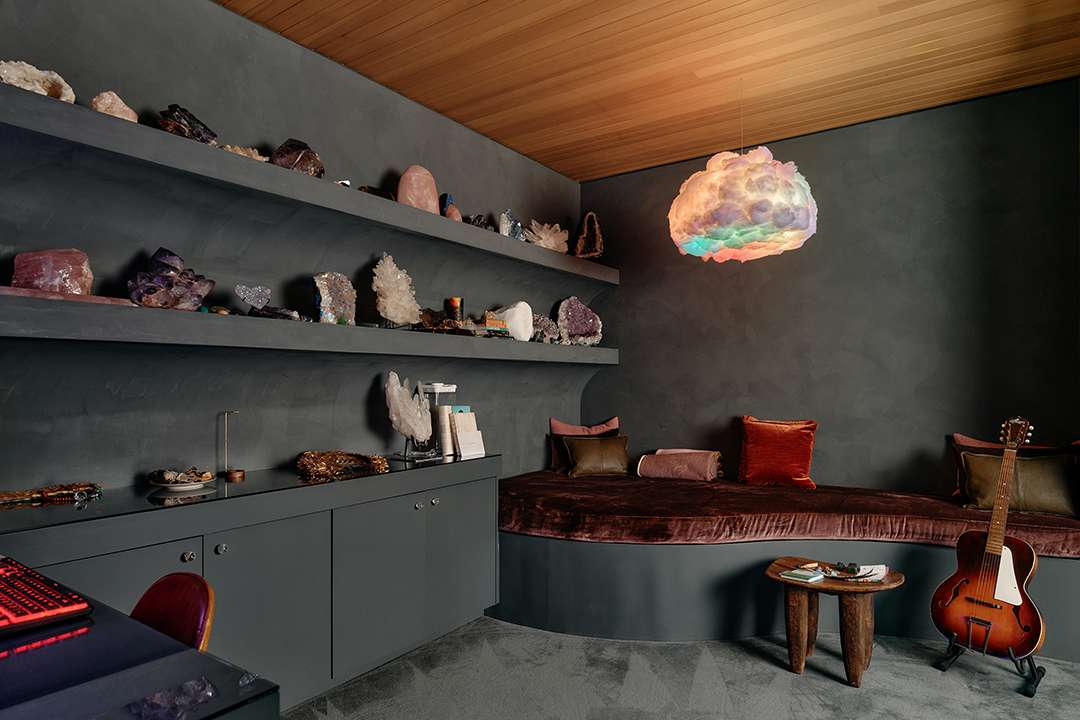 Lizzo's crystal collection and red and black day bed